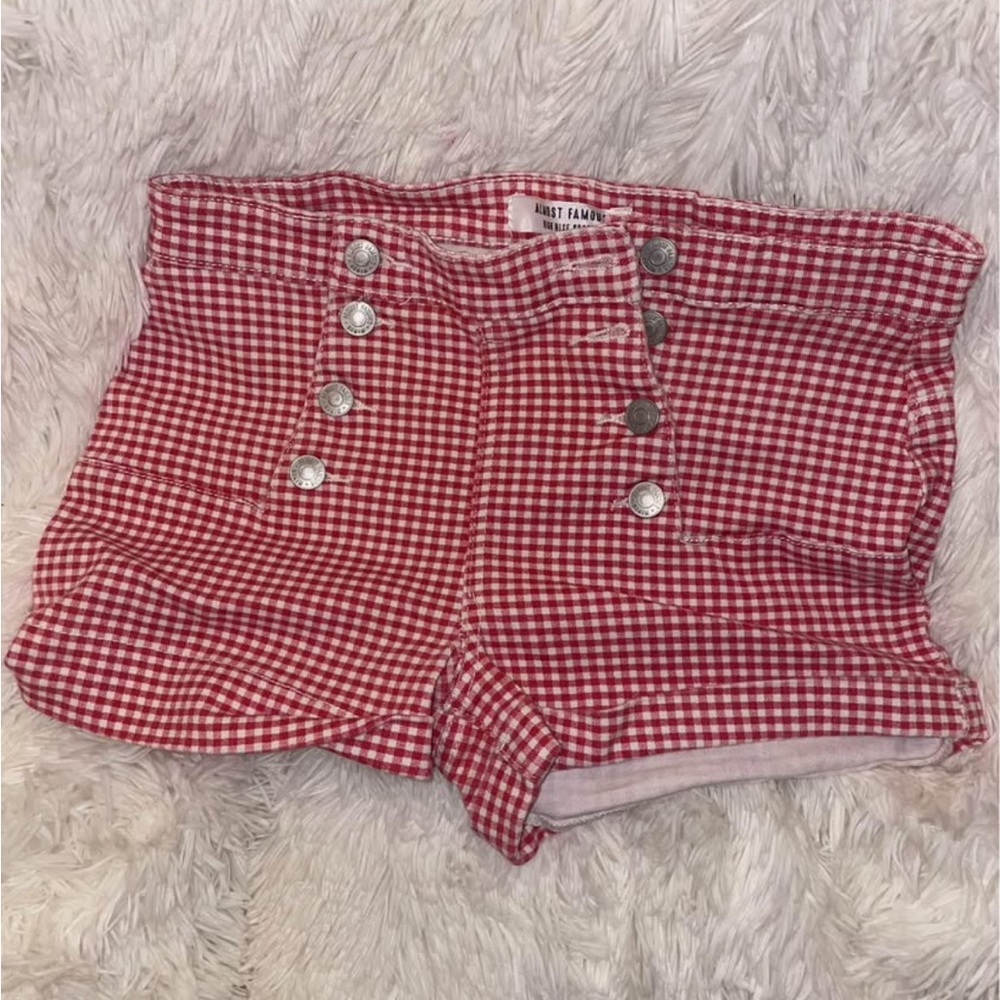 Plaid red/white shorts.
Size 5